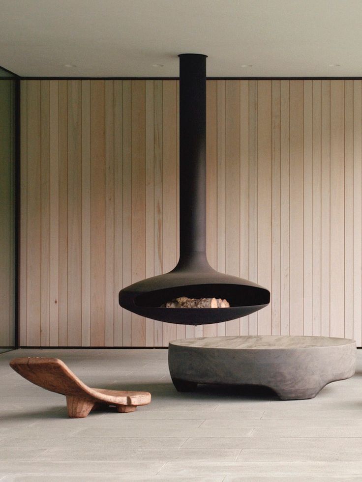 a modern fireplace in the middle of a room