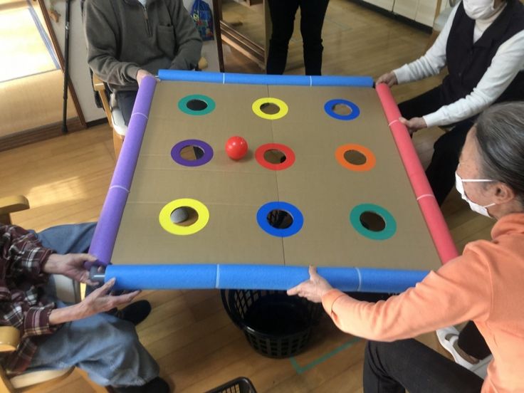 several people are playing an interactive game in the living room