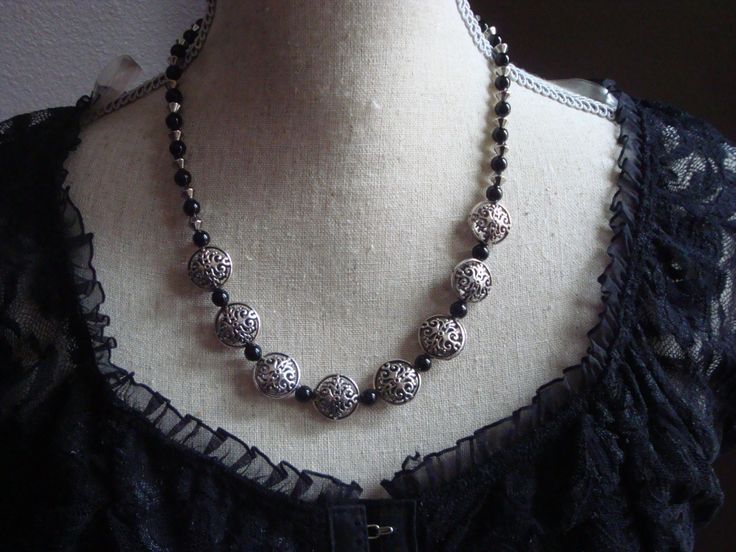 This gorgeous 18" necklace is made of black glass beads with silver metal embellishments.  How beautiful this would look with that basic black dress!! Black Metal Necklace With Silver Beads, Black Metal Necklaces With Silver Beads, Black Necklace With Silver Beads, Black Metal Beaded Necklace With Silver Beads, Black Beaded Necklace With Silver Beads, Elegant Black Beaded Necklace With Silver Beads, Black Necklace With Spacer Beads For Party, Nickel-free Black Beaded Necklaces With Round Beads, Nickel Free Black Necklace For Party