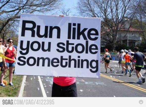 a person holding up a sign that says run like you're going to rural mile easily