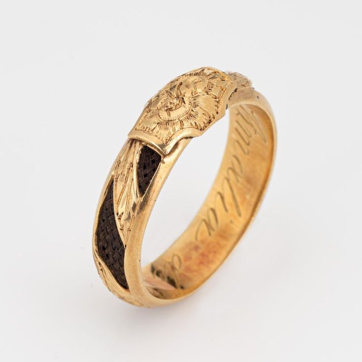 Finely detailed antique Victorian ring (circa 1880s to 1900s), crafted in 18 karat yellow gold.    In the Victorian era, hair jewelry held immense sentimental value and served as a unique and poignant form of remembrance and mourning. The ring has intricately braided hair embedded into the band and around the entire circumference of the ring. Hair jewelry was a deeply personal and intimate memento symbolizing the eternal connection between the living and the departed. Hair jewelry today if sought after by collectors for their tangible links to a bygone era of remembrance and expression. The band has a low profile, rising 3mm from the finger (0.11 inches) and sits comfortably on the finger. The ring is a larger size (US 10) and is unfortunately not sizable. The inner band is engraved 'Amali Ceremonial 14k Gold Jewelry With Historical Design, Heirloom Yellow Gold Signet Ring For Commemoration, Victorian Engraved Yellow Gold Ring For Ceremonial Occasion, Antique 14k Gold Engraved Ring For Commemoration, Antique Yellow Gold Rings For Commemoration, Yellow Gold Hallmarked Engraved Ring For Commemoration, Yellow Gold Jewelry With Historical Design For Formal Events, Yellow Gold Jewelry With Historical Design For Anniversary, Elegant Gold Signet Ring For Commemoration