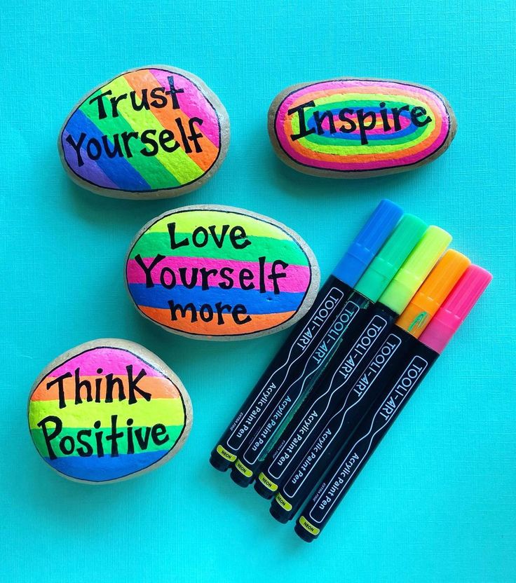 some rocks with writing on them next to markers and pens that read trust yourself, love yourself, think positive