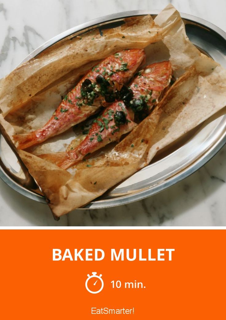 baked mullet in a tin on a marble table