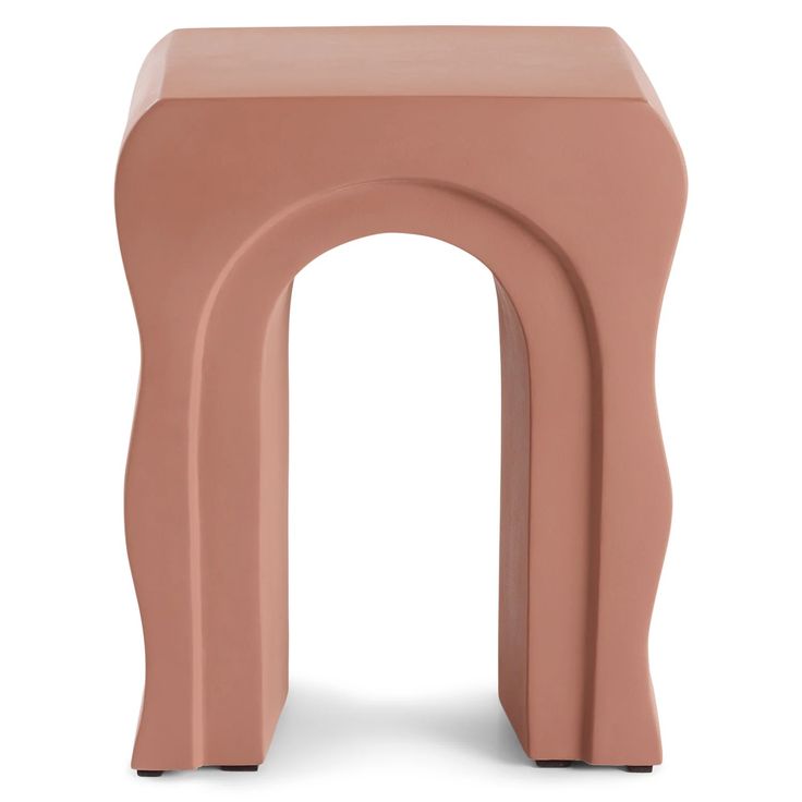 a small pink stool with an arch design