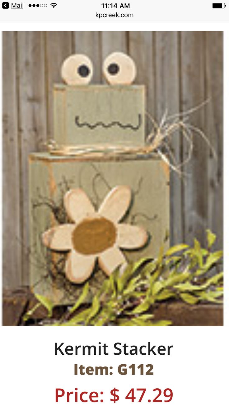 a wooden block with a flower on it and the words kermit stacker item g112 price $ 47 29