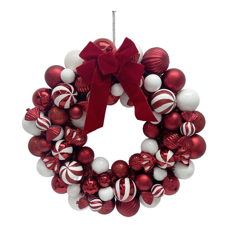 a red and white christmas ornament wreath