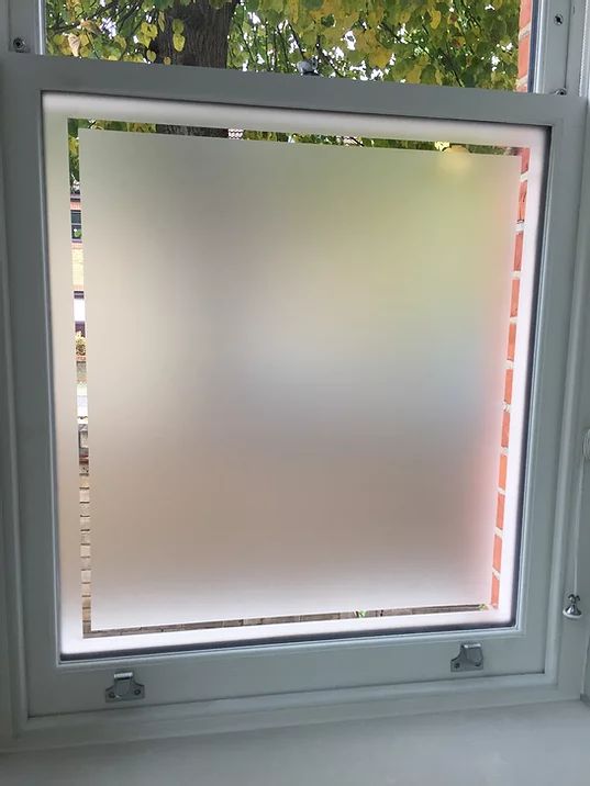 an open window with blinds on the outside