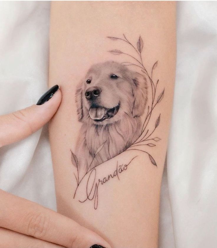 a woman's arm with a tattoo of a dog and the words grandma on it