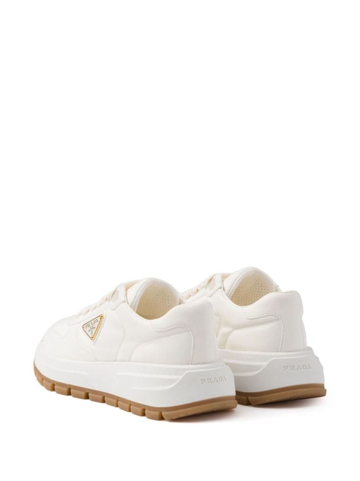 Find PRADA Triangle-logo Leather Sneakers on Editorialist. white leather branded heel counter triangle logo logo-debossed tongue front lace-up fastening round toe ridged rubber sole Prada Sneakers, White Sneakers Women, Deer Skin, Triangle Logo, Sneakers Blue, Prada Shoes, Suede Sneakers, Canvas Sneakers, Shoe Lover