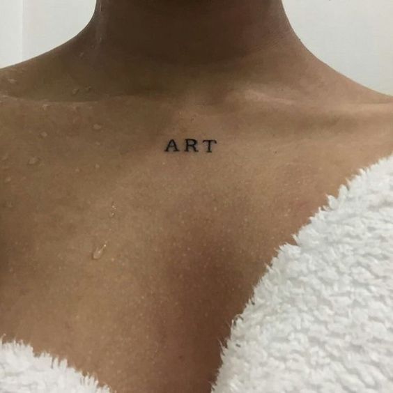 a woman's chest with the word art written on it