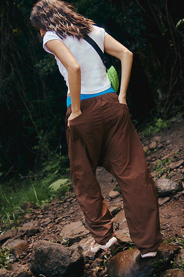 Hike on in these durable, water-resistant pants, featuring a slightly barrel-legged silhouette and easy-access doubled front pockets. **Fit:** Relaxed fit; barrel leg; high-rise **Features:** 100% Nylon fabrication; water-resistant; durable; drawstring adjustable waistband; snap closure fly; doubled front pockets; drop in back pockets; hits just above ankle **Why We | Well Played Pants by FP Movement at Free People, Argon Oil, XS Argon Oil, Adjustable Waistband, Fp Movement, Drop In, Pants Women, Boho Clothing, Boho Outfits, Barrel, Active Wear