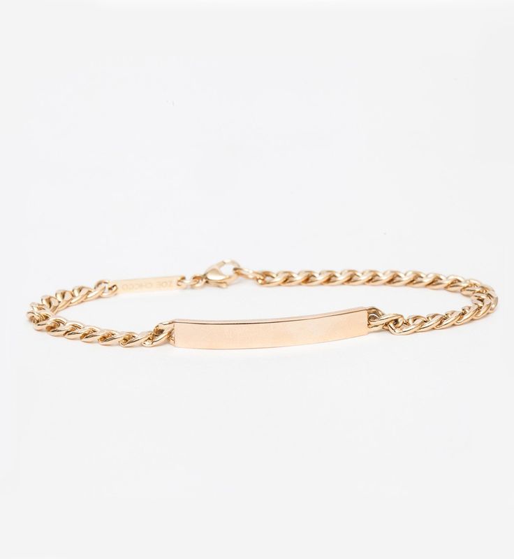 A name? A date? A mantra? Personalize the gold bar on this ID bracelet so a simple piece of jewelry becomes something meaningful and irreplaceable. Alternatively, hide your message on the inside for an intimate customization that's only for you. Give it as a gift and turn a personal connection into something they can wear forever. Finished with a hallmarked logo plate and lobster clasp. Made in the U.S.A. We suggest eight characters for the most visible engraving. To inquire, including requests Personal Connection, Zoe Chicco, Id Bracelets, Gold Bar, Long Chain, Curb Chain, Your Message, Mantra, A Name