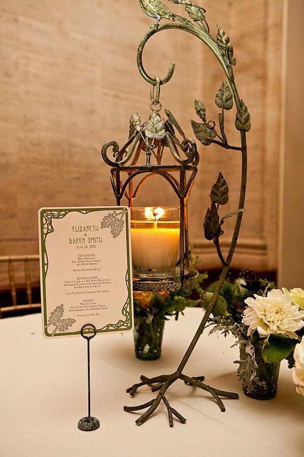 a table with flowers and a candle on it