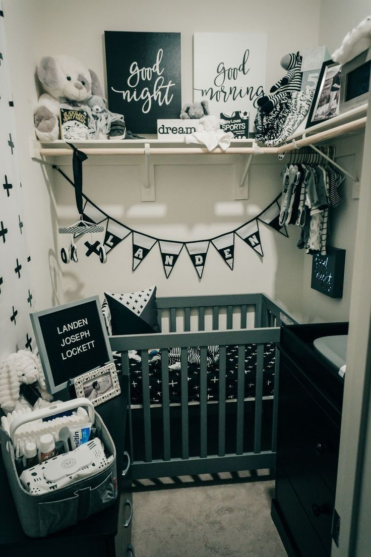 a baby's room is decorated in black and white