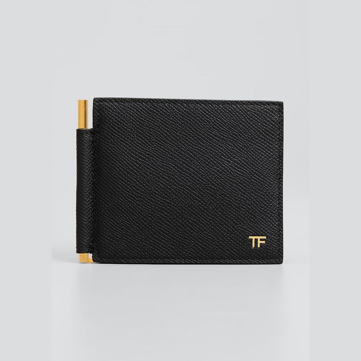 TOM FORD "T-Line Money Clip Wallet" in grain calf leather Approx. 4.1"L x 0.3"W x 3.5"H Embossed gold-tone logo monogram at front Eight card slots One central gold-tone money clip  Interior foiled logo Classic T-line interior structure Tonal stitching Made in Italy Tom Ford Men, Clip Wallet, Money Clip Wallet, Monogram Logo, Money Clip, Tom Ford, Leather Men, Calf Leather, Tops Designs