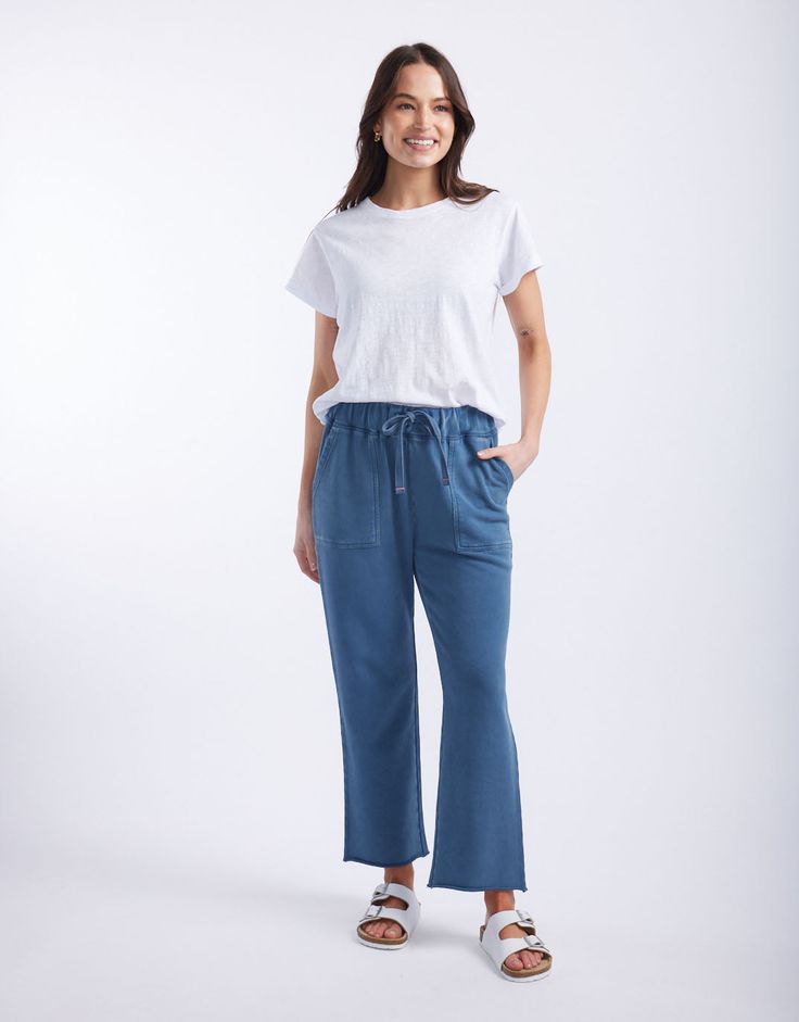 DESCRIPTION Elevate your casual wear with the Raw Edge Lounge Pant in Denim by White & Co. The Label. These lounge pants are designed for ultimate comfort and style, featuring a relaxed fit with a drawstring waist and raw edge hem. The soft denim colour adds a modern touch, while the large front pockets provide both practicality and a chic look. Perfect for lounging at home or running errands, these French Terry pants will become your go-to for effortless, laid-back style. Pair the Raw Edge Loun Denim Colour, French Terry Pants, Laid Back Style, Colored Denim, Denim Pant, Lounge Pants, Raw Edge, Running Errands, French Terry