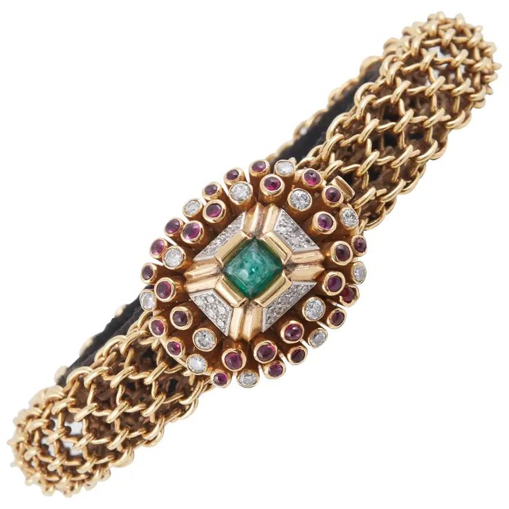 For Sale on 1stdibs - Unique bracelet finely crafted in 18K Yellow Gold with beautiful clasp, centering sugarloaf Emerald, surrounded by cabochon Rubies and diamonds. Signed Fine Jewelry Bracelet With Cabochon, Luxury Yellow Gold Bracelets With Cabochon, Luxury Yellow Gold Cabochon Bracelets, Luxury Jeweled Yellow Gold Bracelets, Elegant Formal Cabochon Bracelets, Luxury Diamond Jeweled Bracelets, Jeweled Bracelets For Formal Occasions, Elegant Jeweled Yellow Gold Bracelet, Elegant Oval Jeweled Bracelets