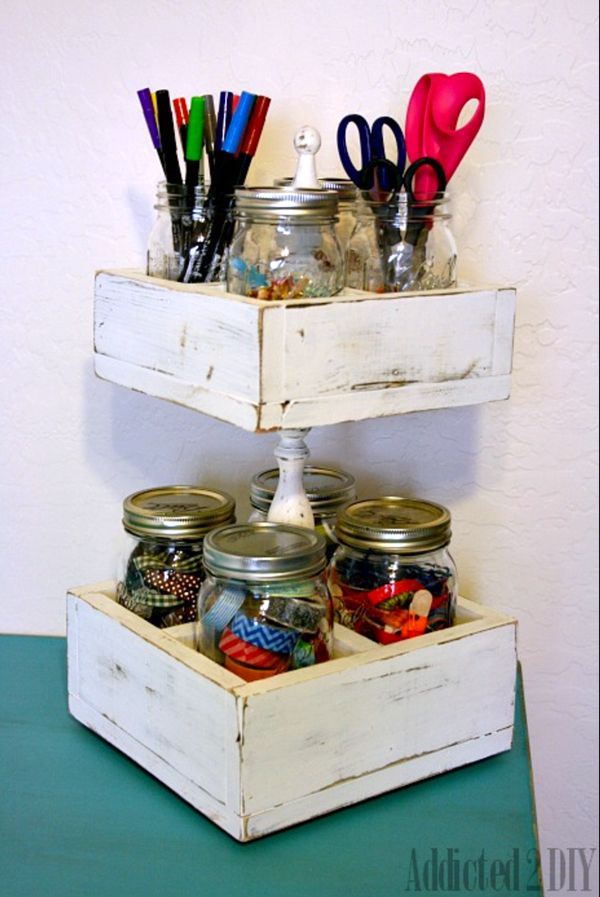 three tiered shelf with jars, scissors and other crafting supplies on it's sides