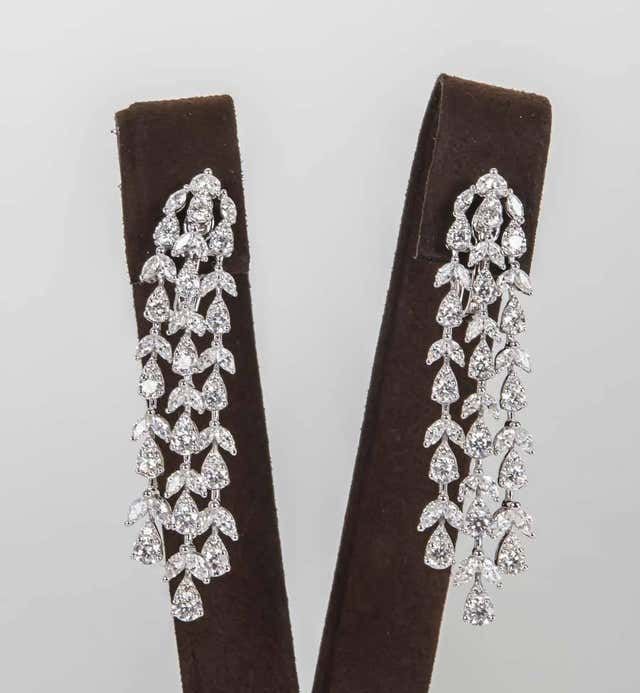 For Sale on 1stDibs - A stunning pair of earrings in a timeless design. 8.12 carats of round brilliant and marquise cut diamonds set in 18k white gold. The diamonds are of Diamond Marquise Bridal Earrings For Formal Occasions, Formal Diamond Marquise Bridal Earrings, Luxury Marquise Diamond Earrings For Formal Occasions, Luxury Marquise Diamond Earrings For Evening, Luxury Marquise Cut Diamond Earrings, Formal Marquise Bridal Earrings With Diamond Accents, Luxury Marquise Diamond Earrings, Luxury Marquise Cut Diamond Earrings For Formal Events, Luxury Marquise Diamond Bridal Earrings With Diamond Accents