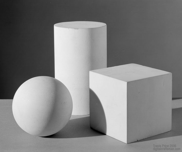 three white objects sitting on top of a table