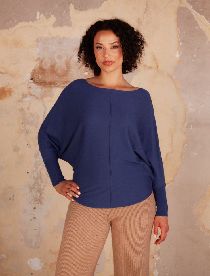 Our bestselling Ryu top is as soft as it is practical. While wearing the brand-newcashmere version, you will feel like you are wearing a piece of heaven. The added touch of the center seam and bat wing sleeve give this top a bit of extra dimension. Boat neck top with Dolman long sleeves and center seam detail 3% Cashmere, 40% Viscose,27% Polyester, 30% Nylon, Style # G550F Blue Cashmere Crew Neck Top, Cashmere Crew Neck Top For Layering, Everyday Fine Knit Cashmere Tops, Blue Cashmere Tops For Layering, Everyday Oversized Soft Knit Tops, Oversized Soft Knit Tops For Everyday, Relaxed Fit Cashmere Tops For Winter, Blue Cashmere Winter Tops, Blue Casual Cashmere Tops