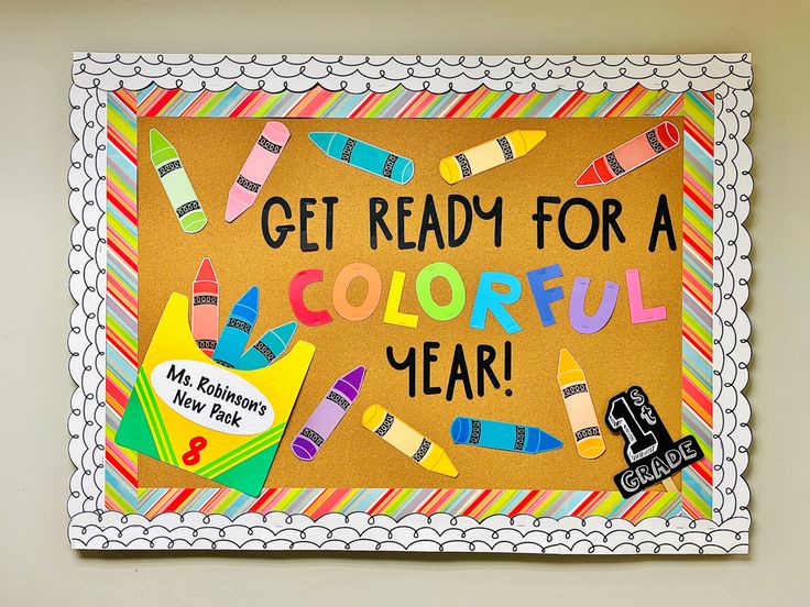 a bulletin board with colorful crayons and writing on it that says, get ready for a colorful year