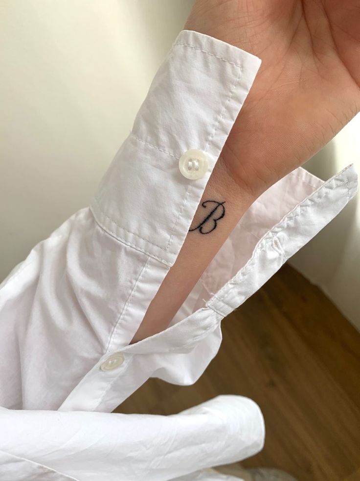 Minimal tattoo initial b letter B Initial Tattoo Ideas, Intial B, The Letter B Tattoo, Minimal Initial Tattoo, Small B Tattoo Letter, Initial B Tattoo, Cursive B Tattoo, B Tattoo Letter Initial, Tattoo Letter B