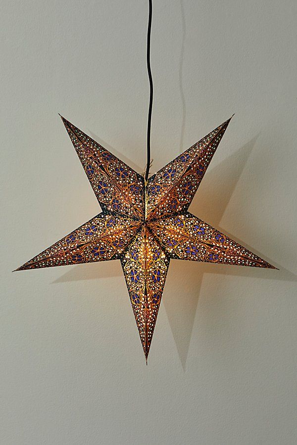 an origami star hanging from a string