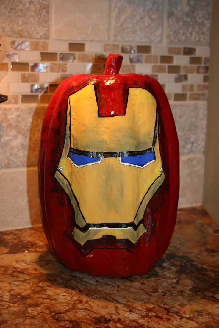 an iron man pumpkin sitting on top of a counter