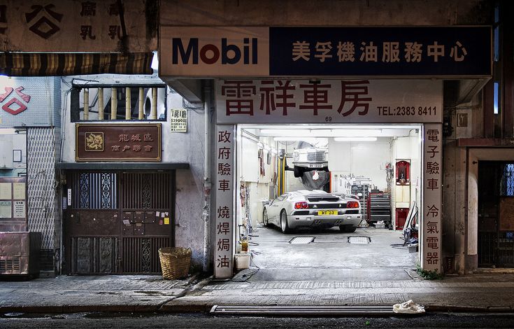 a car is parked in the middle of a garage