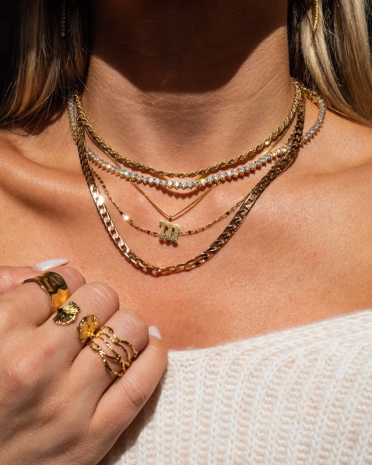 The necklace we’d wear on a summer vacay to Rio. This shimmery rope chain is sturdy and luxe. Pair your stack with a white button up for the easiest look ever. 18k gold plated stainless steel Psst: This piece utilizes durable stainless steel that's tarnish/water resistant - feel free to wear it 24/7! Thickness: 3 mm Length: 16" Make your jewelry last! Click here for jewelry care. Need a gift box? We got you. Neck Stack, Dainty Initial Necklace, Initial Necklace Gold, Lower Case, Jewelry Studio, White Button Up, Rope Necklace, Old English, Box Chain