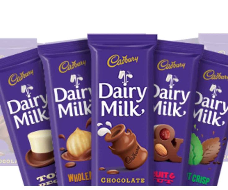 caddy dairy milk chocolate bars are lined up in a row on a white background