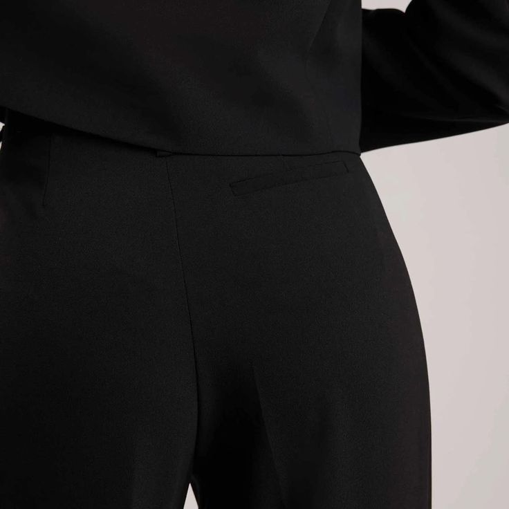 The front of the pants is adorned with welt pockets, adding a touch of sophistication to the design and providing functionality for storing small essentials. The pants are fastened by a front zip, ensuring a secure and seamless closure. With their sleek and streamlined design, the Argan maxi pants can be styled in various ways to suit different occasions. 100% Polyester; Lining: 100% Acetate Please refer to care instructions on garment. Modern Workwear Pants With Concealed Placket, Tailored Semi-formal Bottoms With Side Pockets, Semi-formal Tailored Bottoms With Side Pockets, Workwear Pantsuit With Pockets And Tapered Leg, Tapered Leg Pantsuit With Pockets, Sleek Workwear Pants With Concealed Placket, Tapered Leg Pantsuit With Pockets For Work, Sleek Business Pants With Pockets, Tailored Pantsuit With Pockets And Straight Pants