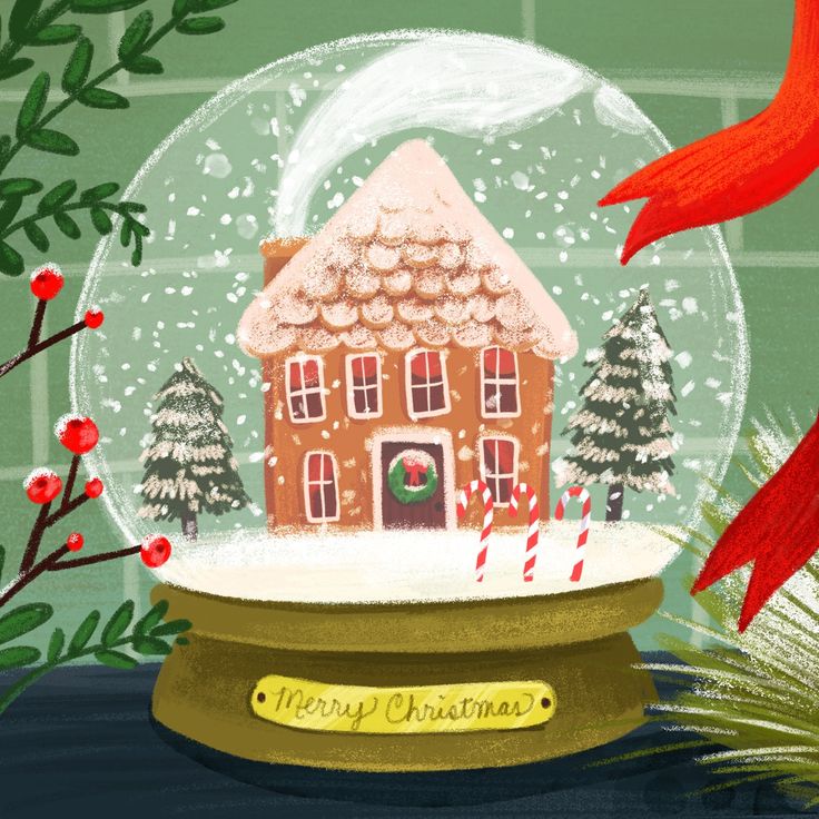 there is a snow globe with a house in it and a red bird next to it