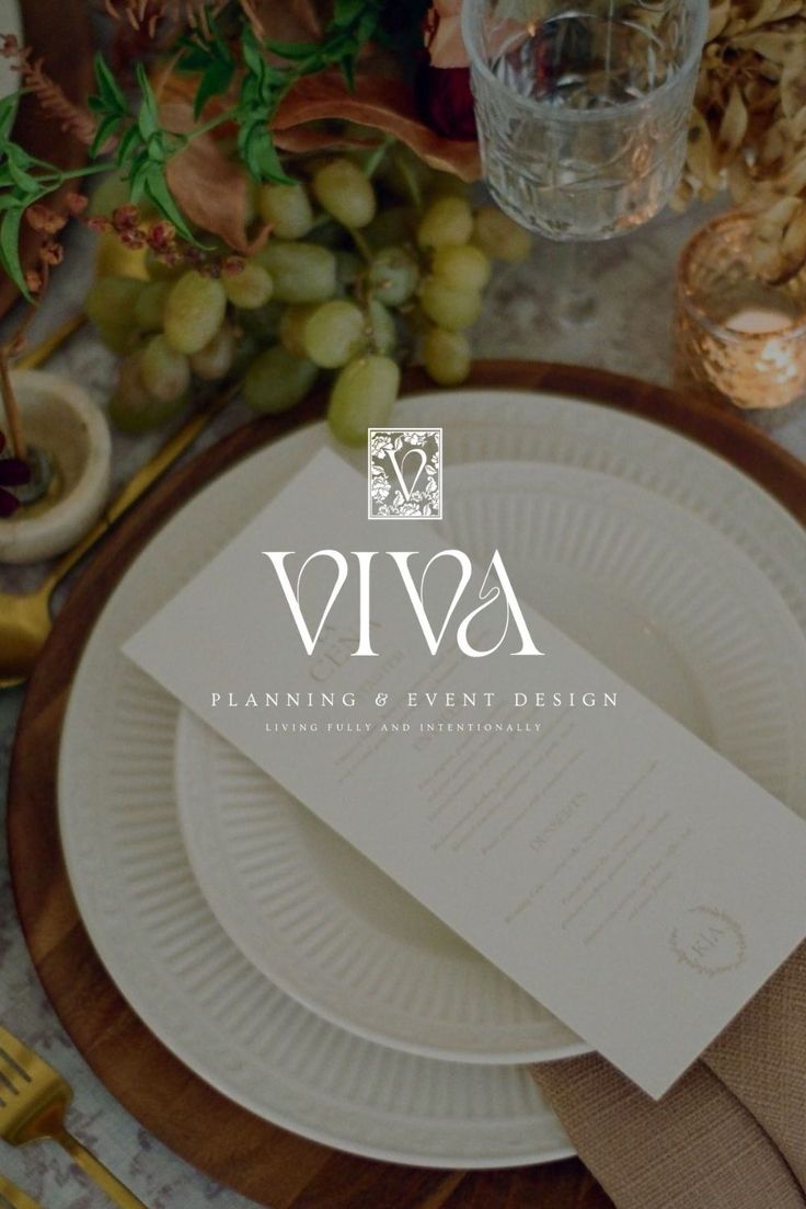 a place setting with white plates and napkins