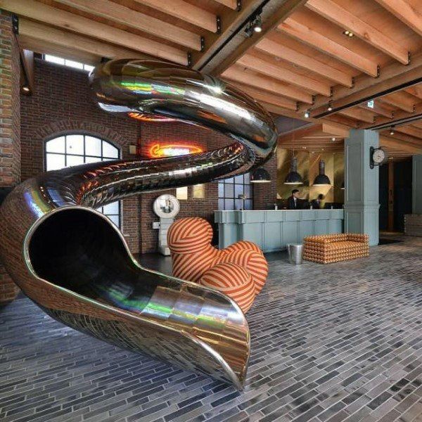 the inside of a building with an indoor slide