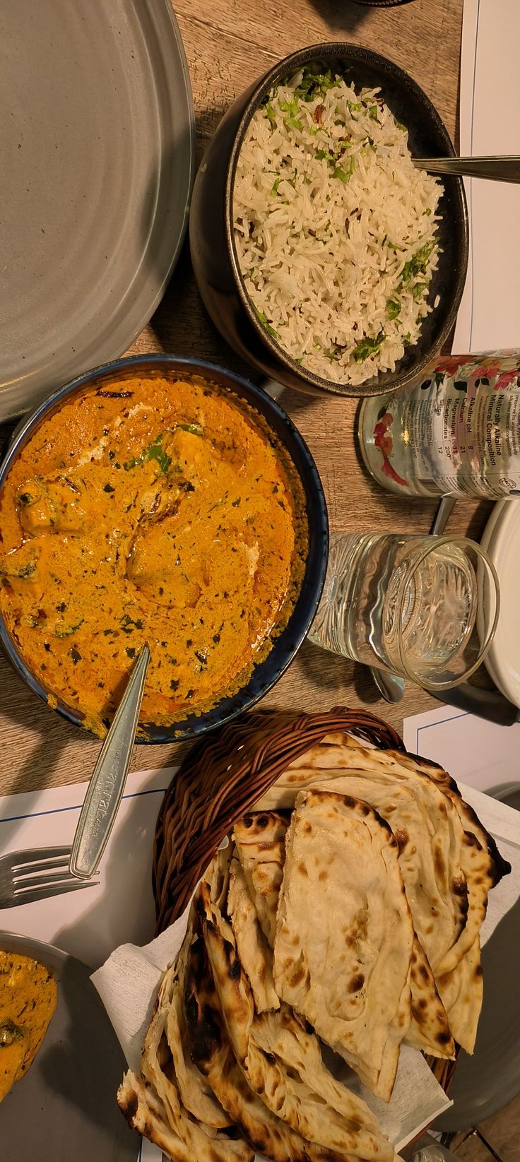 a table topped with lots of different types of food next to plates and utensils