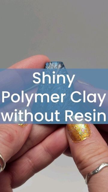 a person holding a piece of glass in their hand with the words shiny polymer clay without resin