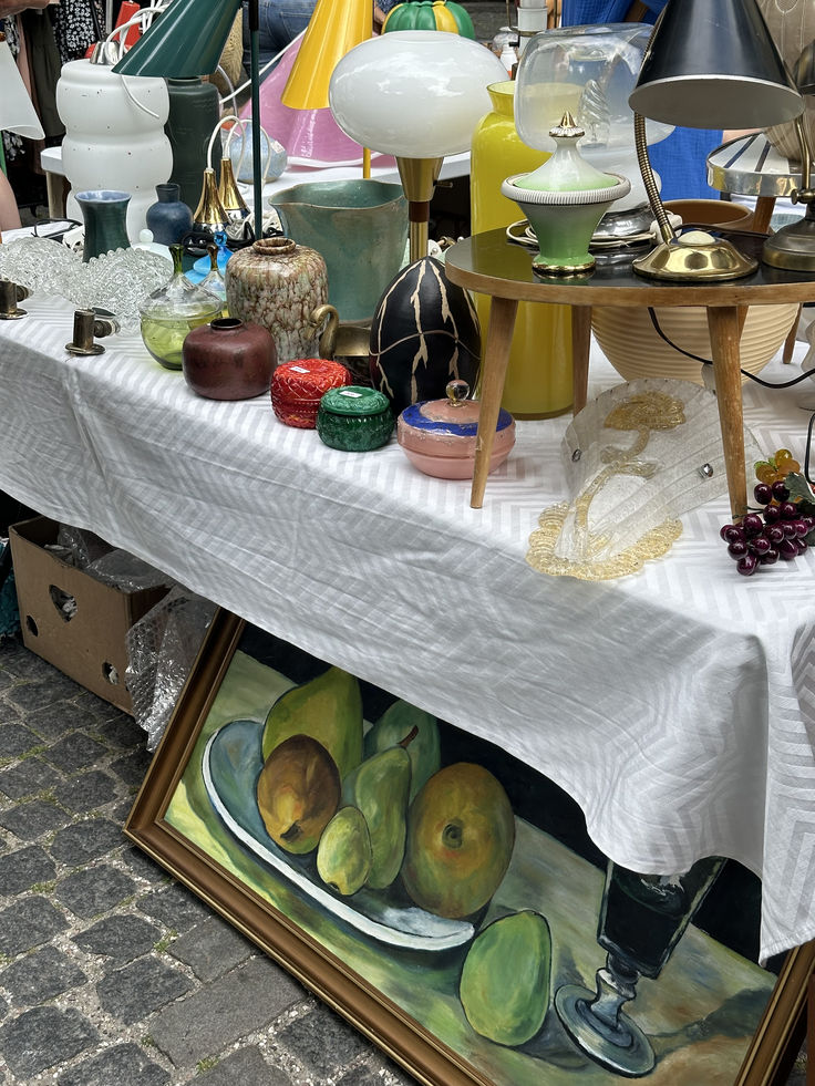 a table topped with lots of different types of fruit on top of a white table cloth