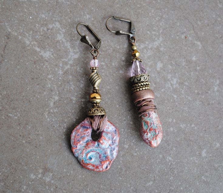 A pair of OOAK Asymmetrical rustic organic earrings. About 6 cm. Copper Brass Artisan beads Wood Sari silk * The artisan beads are created of extra lightweight and durable clay For more Bohemian jewelry, please visit my shop :) https://www.etsy.com/shop/IsadorasDream Bohemian Drop Earrings With Unique Variations, Rustic Dangle Earrings As A Gift, Rustic Dangle Earrings For Gift, Rustic Drop Earrings With Ear Wire, Earthy Handmade Multicolor Earrings, Multicolor Earthy Dangle Earrings, Bohemian Multicolor Wooden Bead Earrings, Artisan Multicolor Brass Earrings, Bohemian Multicolor Hand-strung Earrings