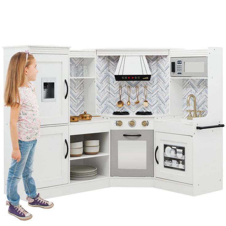 L-SHAPE DESIGN: A convenient construction allows this playset to fit comfortably in the corner of any room, so your child can engage in hours of kitchen adventures! AMPLE STORAGE: Open storage in the fridge, pantry, oven, and sink shelves provide ample space for your child's favorite play accessories from other kitchen sets or stuffies to enjoy their cooking TRUE-TO-LIFE KITCHEN: This includes a built-in play microwave and oven with clicking knobs, a light-up hood that mimics authentic sounds, a Pantry Oven, Kitchen Playsets, Fridge Pantry, Play Corner, Kids Play Set, Corner Kitchen, Play Kitchens, Sink Shelf, Pretend Play Kitchen