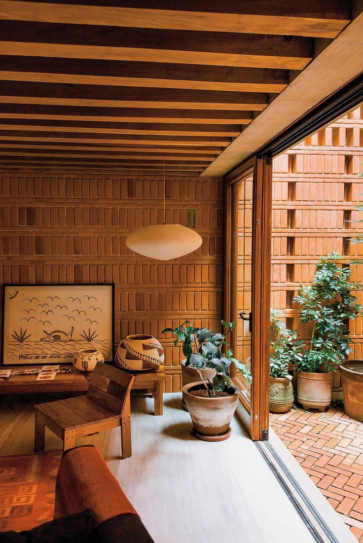 an image of a living room with wood paneling