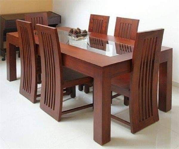 a wooden table with six chairs around it