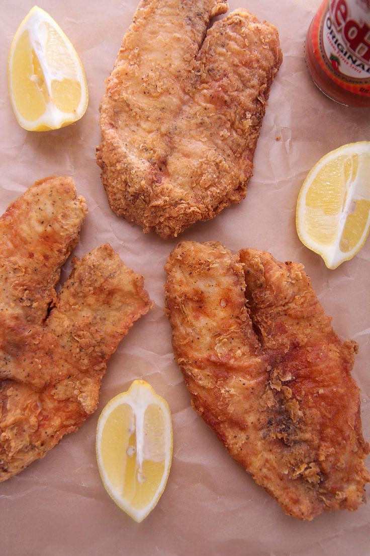 fried chicken with lemon slices and ketchup