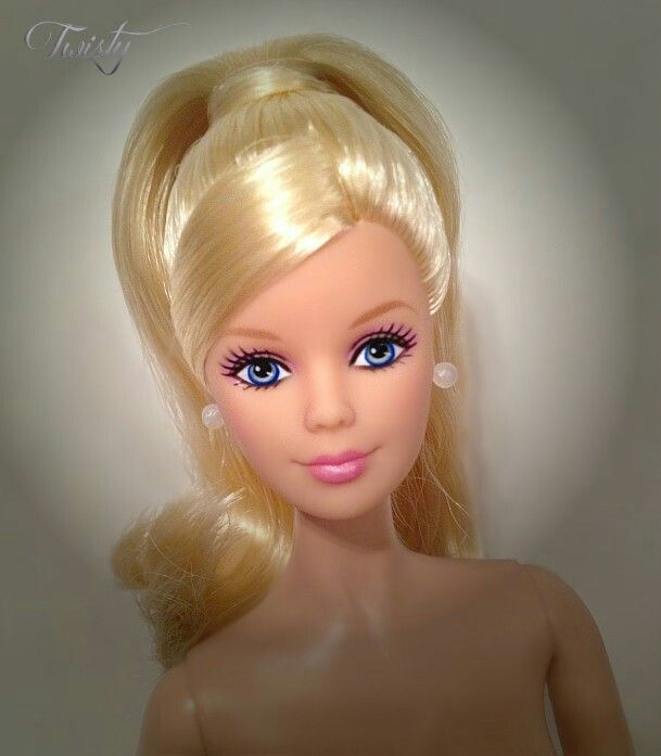 a barbie doll with blonde hair and blue eyes