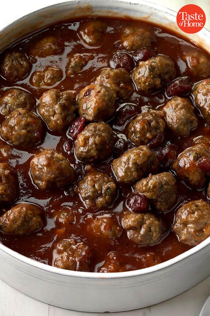 meatballs and sauce in a pot on a table