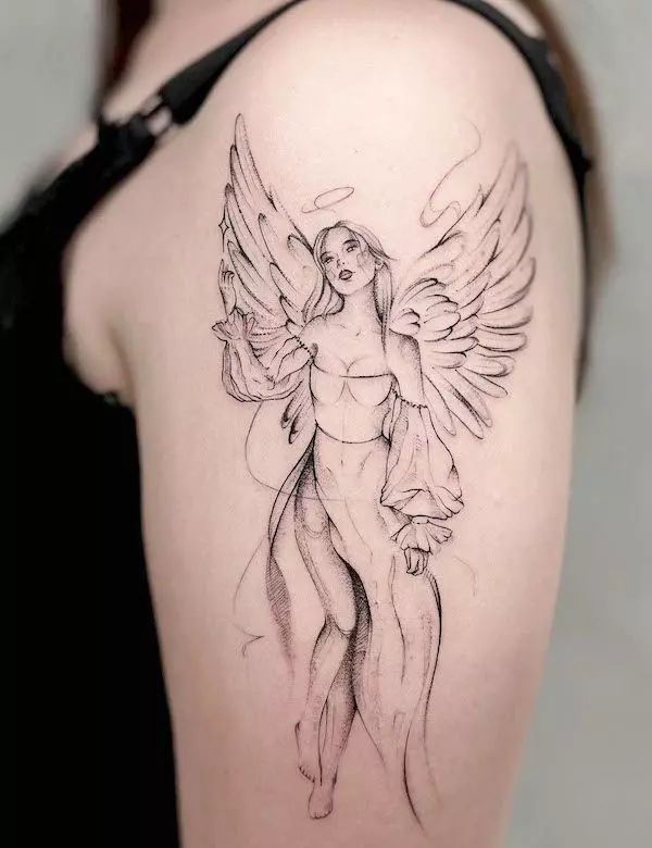 a woman with an angel tattoo on her shoulder