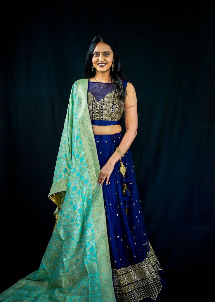 ✨PRODUCT HIGHLIGHTS✨ - Gold embroidery - Soft net design - Woven banarasi with zari brocade 💫MATERIAL & COLOR💫 - Lehenga: Royal blue made with dual layer net & silk - Dupatta: Turquoise made with silk Blue Raw Silk Sets With Cutdana, Blue Raw Silk Sets With Cutdana Details, Blue Chanderi Sharara With Pallu, Transitional Blue Raw Silk Lehenga, Designer Blue Banarasi Silk Sets, Blue Chanderi Sets For Reception, Transitional Blue Lehenga With Dupatta, Blue Unstitched Choli For Transitional Season, Blue Lehenga With Dupatta