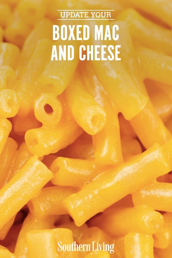 a close up of macaroni and cheese with the words update your boxed mac and cheese