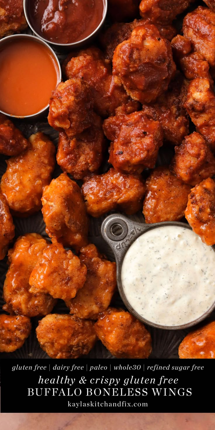 chicken wings and dipping sauces on a plate with the words healthy & crispy buffalo wings